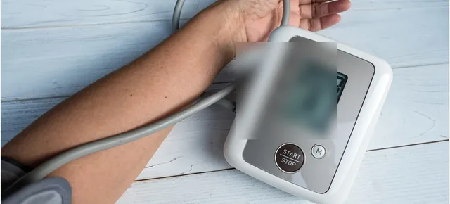 A blood pressure monitor on an arm